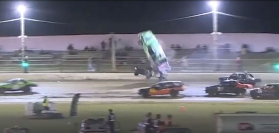 After the car in front rolled, the green car was sent flying vertically