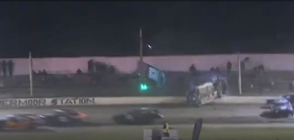 Somehow no one was hurt as the car hit the stands