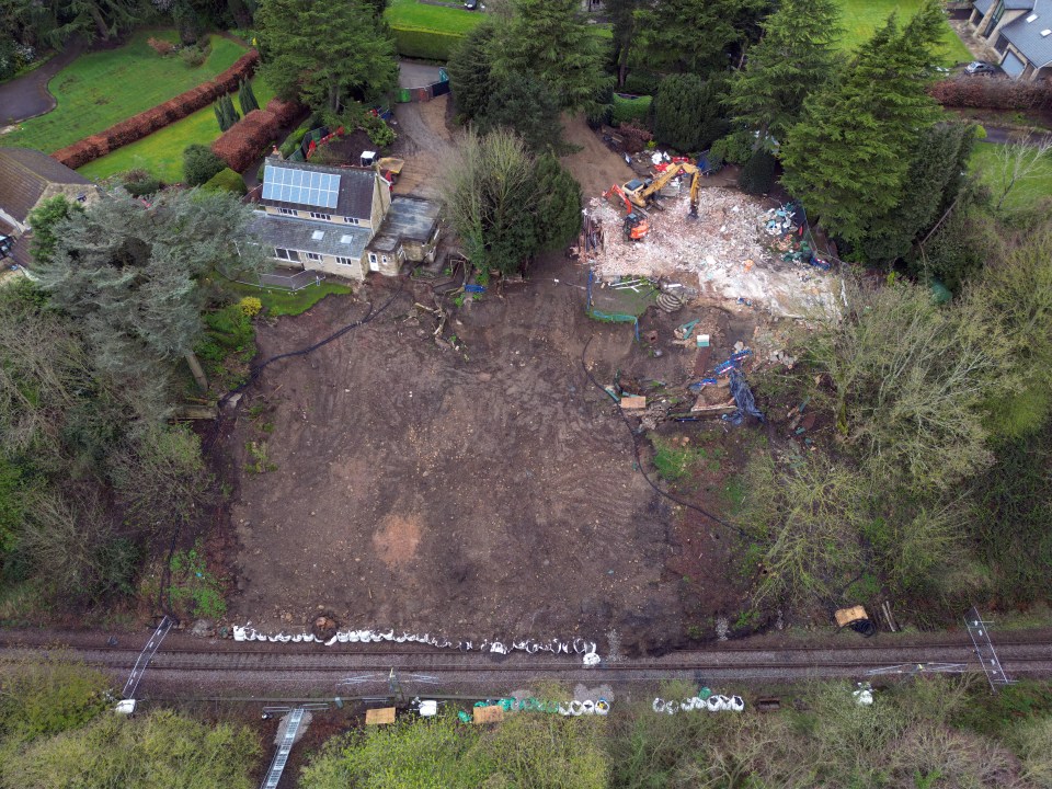 This bird's eye view shot in comparison shows one house now completely gone