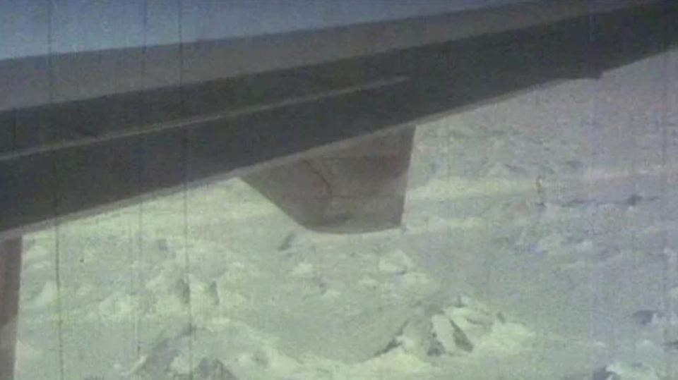 Another photo taken by a passenger showing the view of Antarctica from outside their plane window