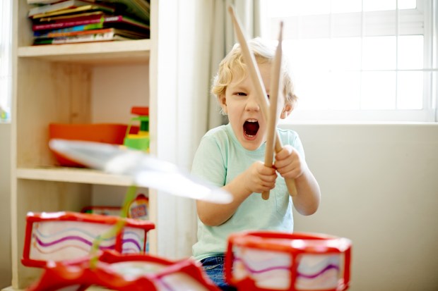 Shot of a little boy playing with a toy drum set//195.154.178.81/DATA/i_collage/pu/shoots/805790.jpg