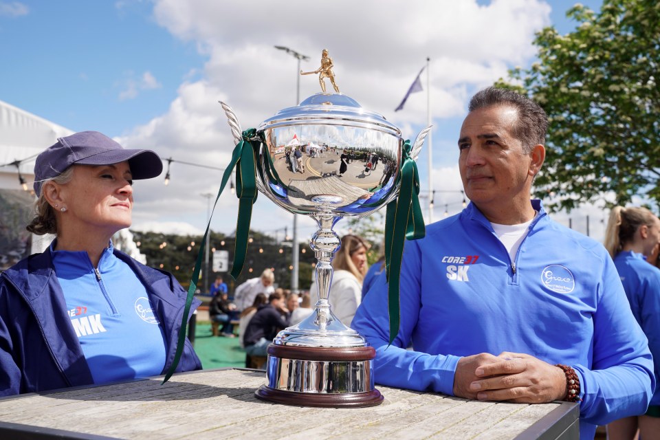 Grace O’Malley-Kumar's parents Sinead and Sanjoy  with the trophy at the tournament