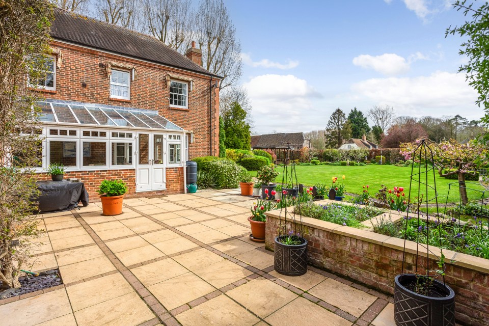 There is a detached double garage with an adjoining studio that could serve as a home office