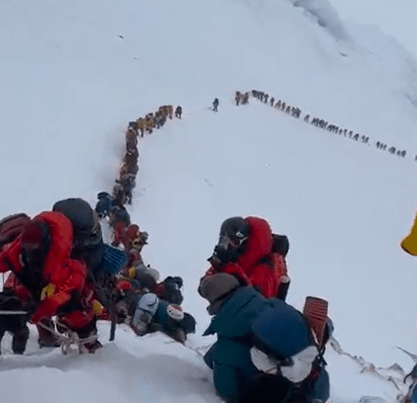 Hundreds of climbers can be seen making a painfully slow way up the Everest