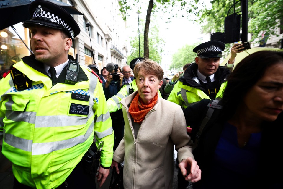 The former Post Office chief executive was flanked by cops outside the inquiry