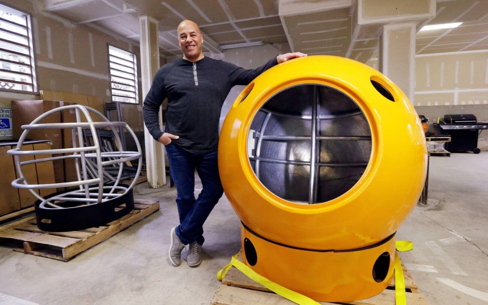 Survival Capsule developer Julian Sharpe stands with his two-person pod at his shop in Washington, US