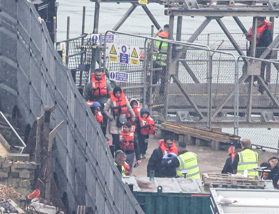 On Sunday, while 54 migrants crossed the Channel, 218 were stopped from leaving France or returned there - pictured women and children at Dover yesterday