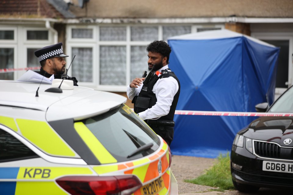 Two officers guard the crime scene