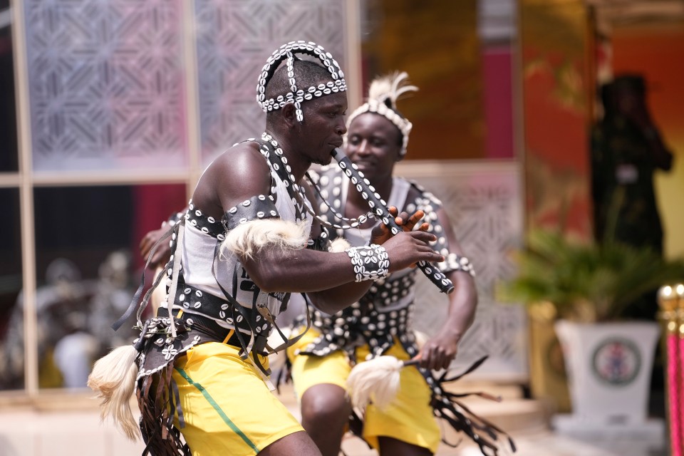 Traditional dancers perform prior to the arrival of Prince Harry and Meghan at the Defence headquarters