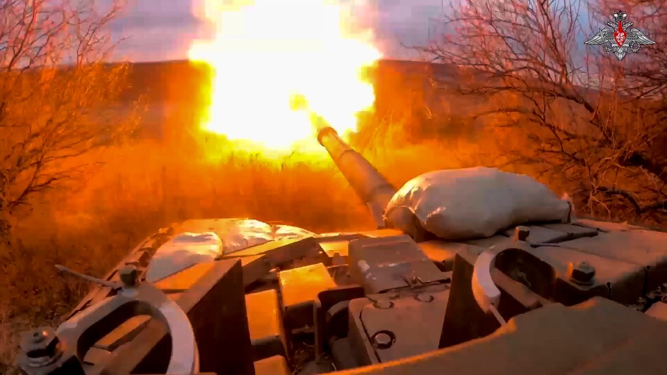 A Russian tank fires on Ukrainian positions at the frontline