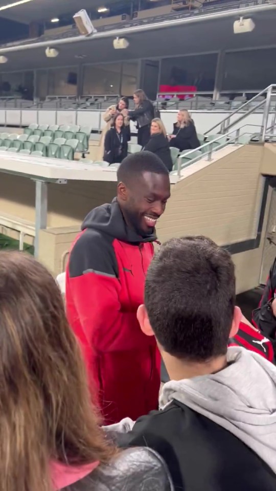 The defender burst into laughter and smiled after hearing the fan's chant