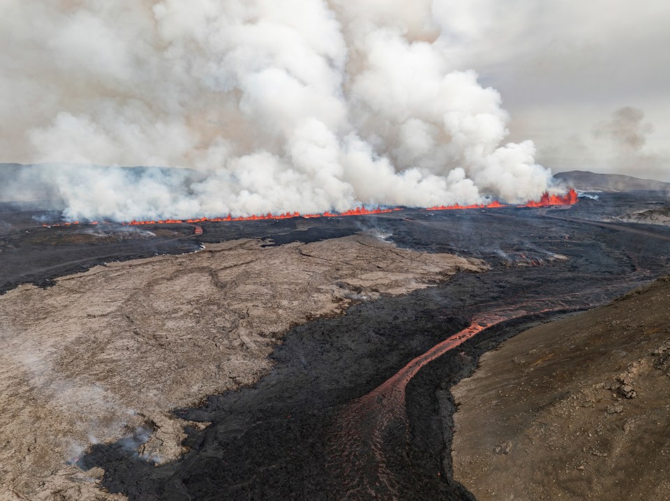 Red streams of lava were pictured spewing from the volcano