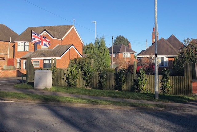 A Wigston resident has been forced to cut his fence in half