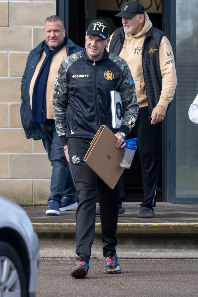 Fury joined by his manager Spencer Brown, left, and dad John