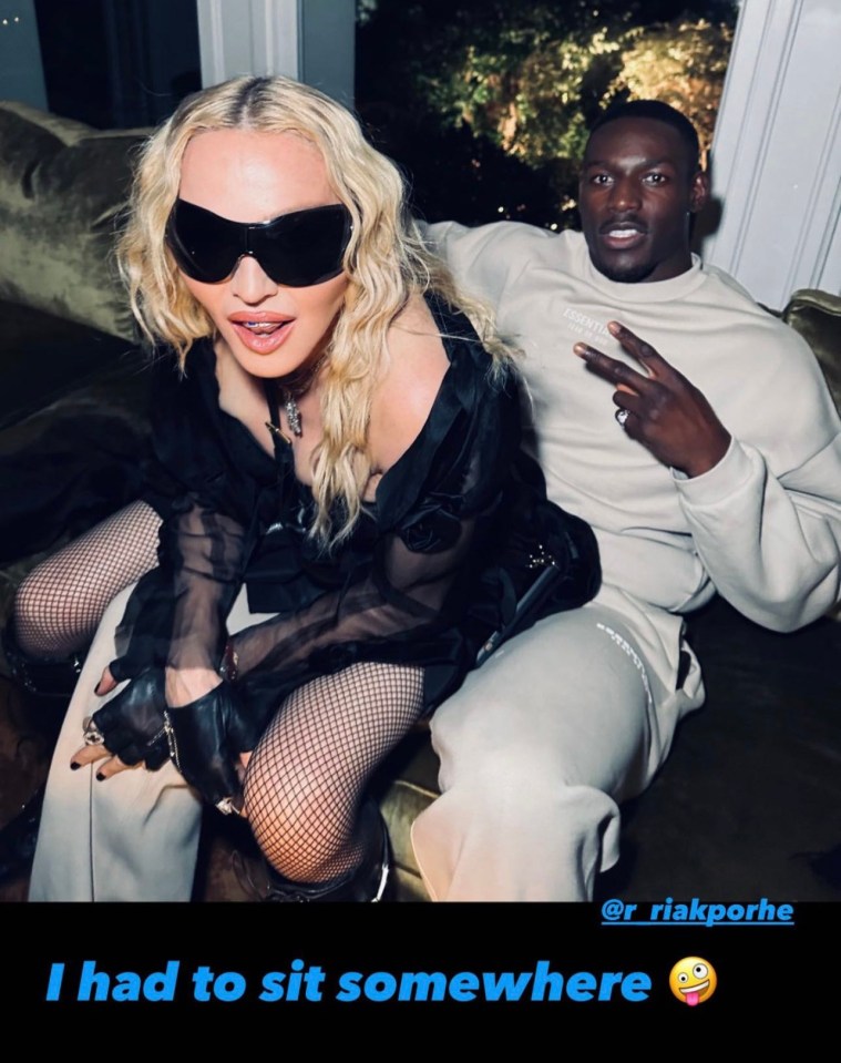 Madonna shared this picture of her straddling Richard Riakporhe with the caption: 'I had to sit somewhere'