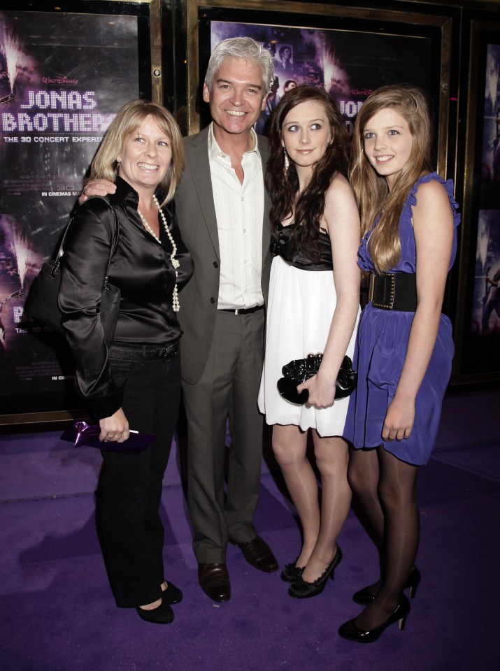 Phil pictured with his estranged wife Stephanie and their two daughters