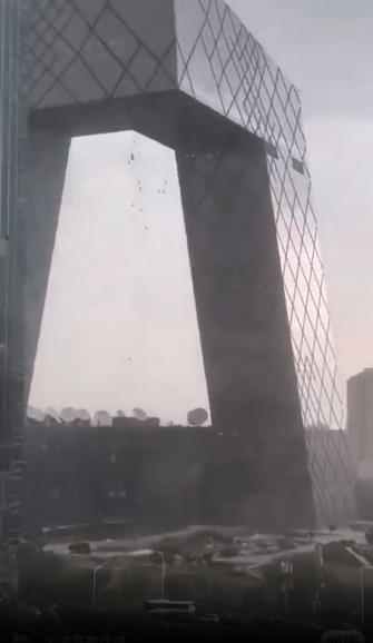 The workers were dangling from one of Beijing's tallest buildings