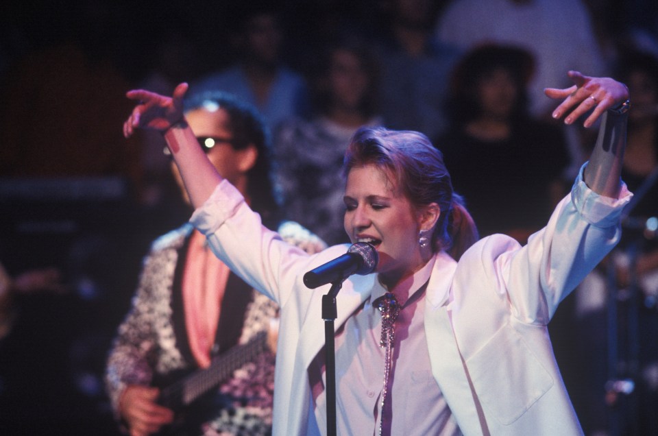 Valerie Day singing on stage in the 1980s