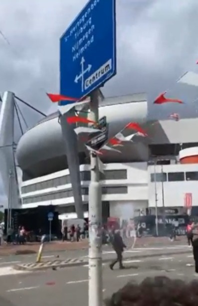 The footie fan waves a flare around outside the Dutch stadium