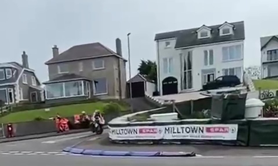 The bike racer was catapulted 25ft through the air in a 100mph crash