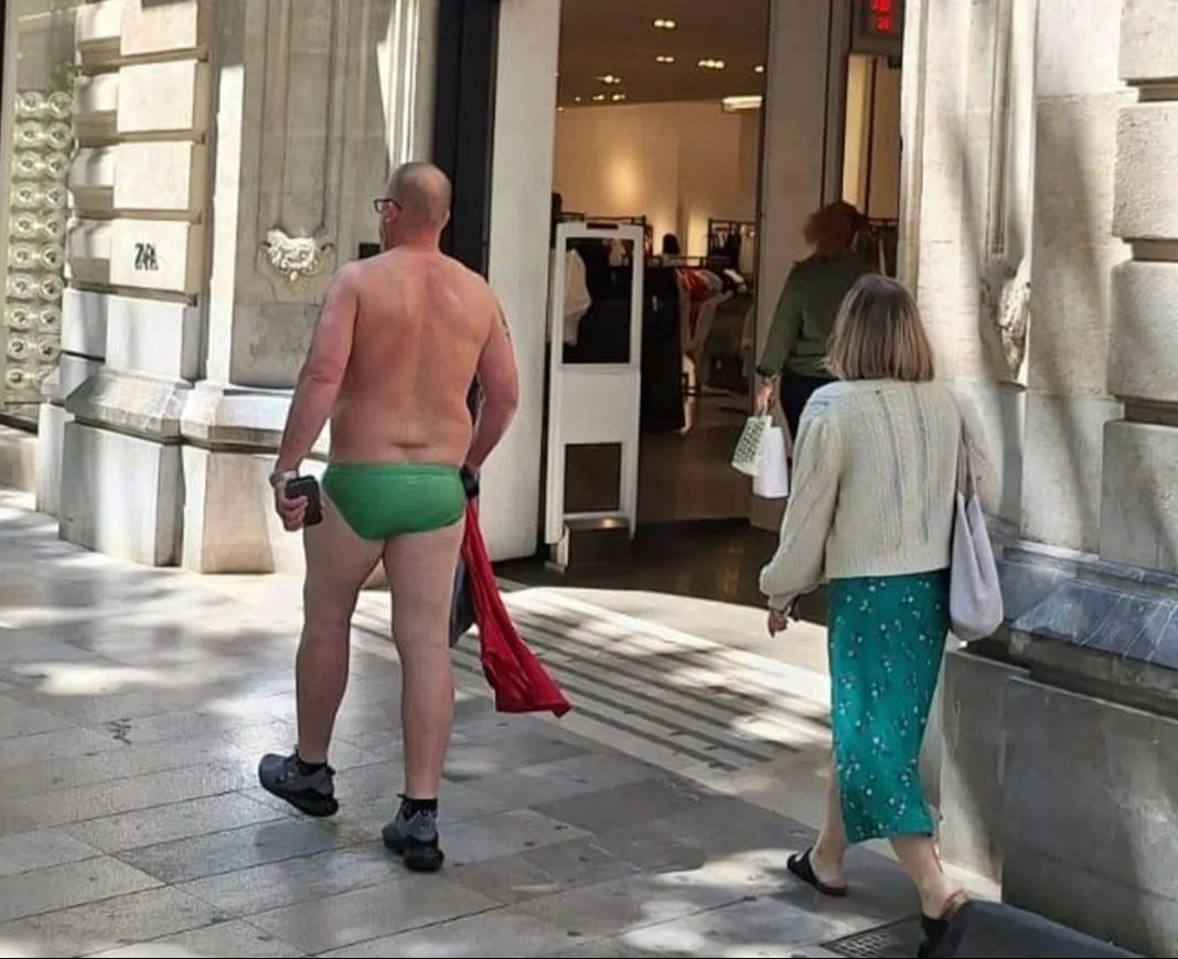 A tourist was seen walking in Majorca wearing only a pair of swimming trunks