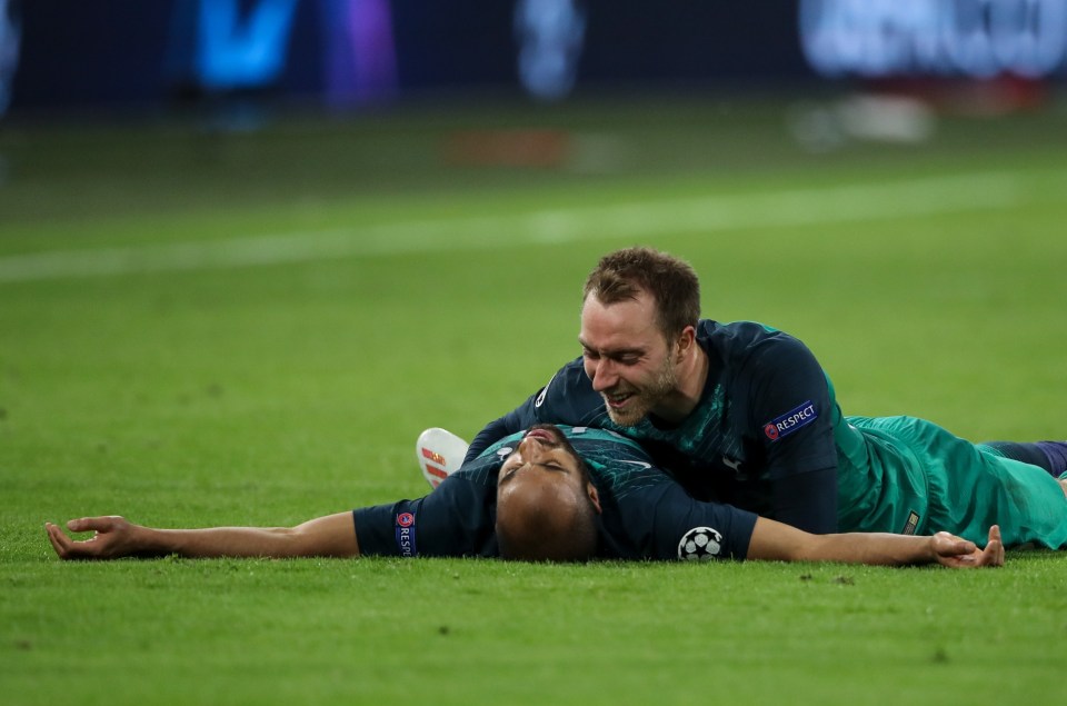 Christian Eriksen hugs Lucas Moura in Amsterdam