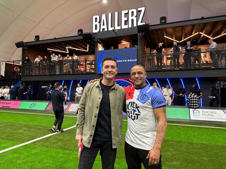 Roberto Carlos with SunSport's Will Pugh at the opening of Ballerz football centre in Kent