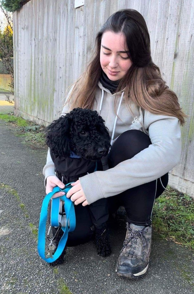 Katie, with her new medical alert dog Oscar who barks when he notices her symptoms are worsening