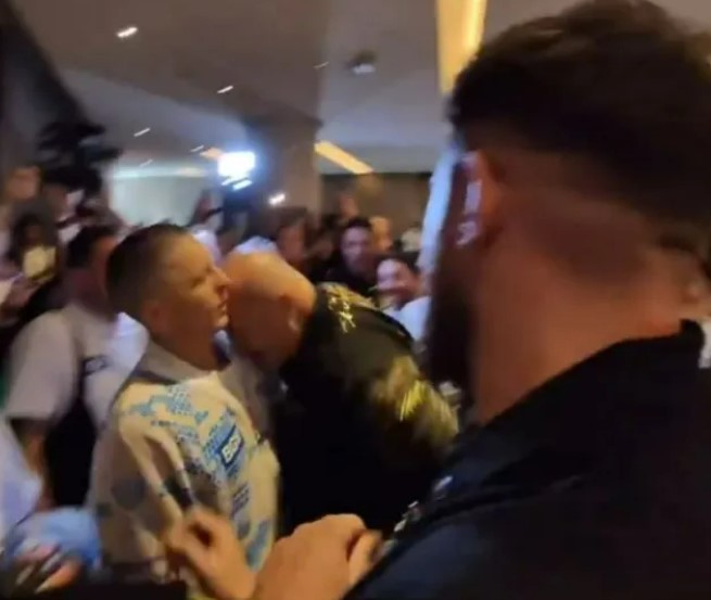 John headbutted a young member of Usyk’s staff on Monday