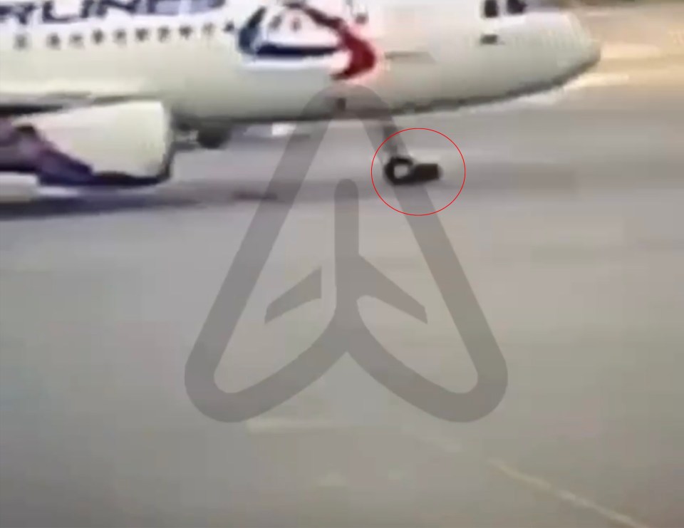 The man is now fighting for his life after being crushed by the aircraft's front landing gear