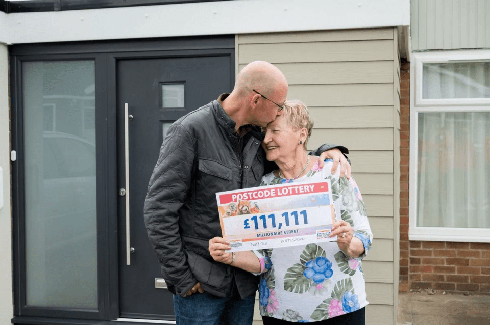 Neighbour Olga, hugged by son Paul, was also a winner