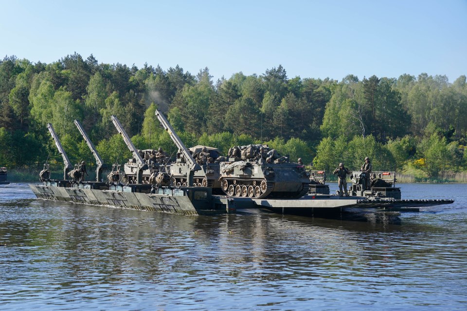 Hundreds of armoured vehicles crossed the Drawa River in Poland after British Royal Engineers constructed amphibious barges