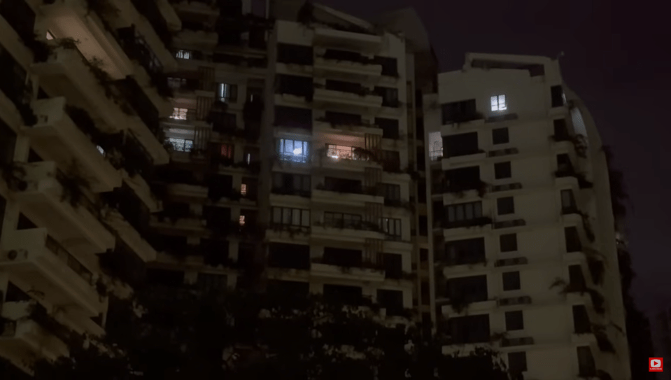 A handful of units have their lights on at night when the city is immersed into darkness