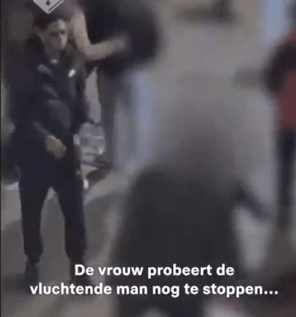 The moment a drug dealer in Amsterdam is believed to have brandished a knife before stabbing a Brit tourist