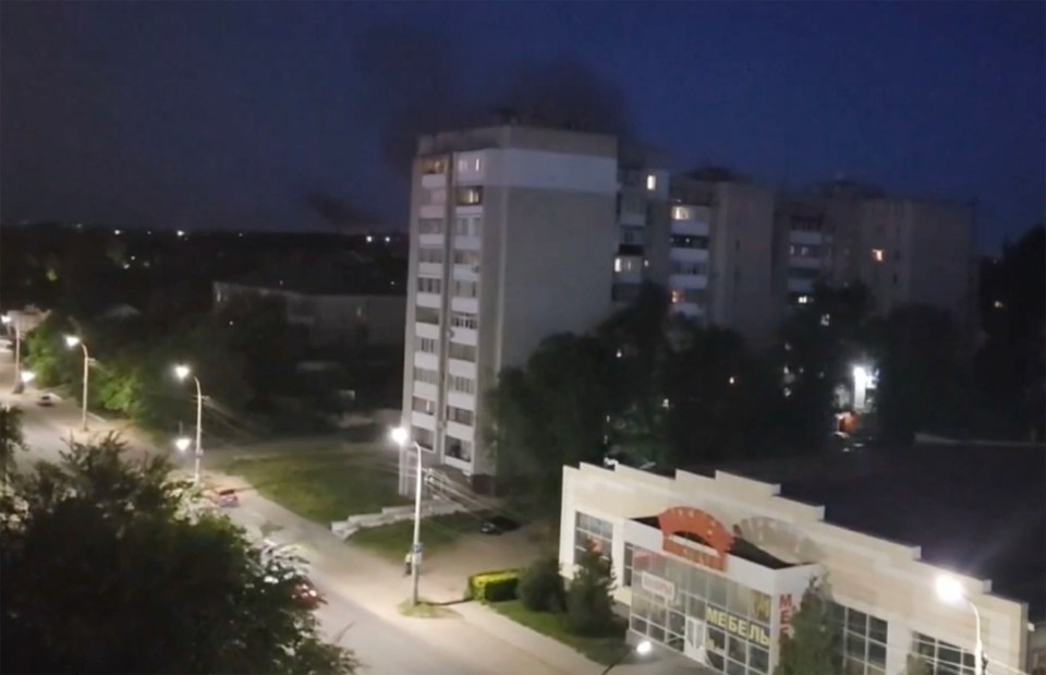 Black smoke rises above buildings in Luhansk