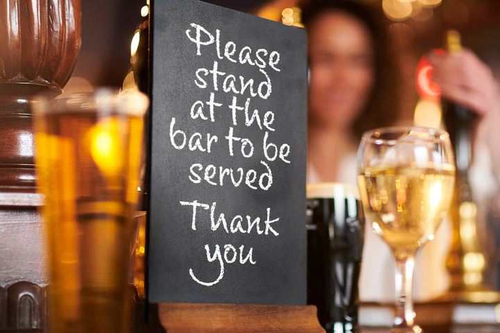 A Liverpool boozer put up a sign instructing patrons to stand at the bar (mock image)