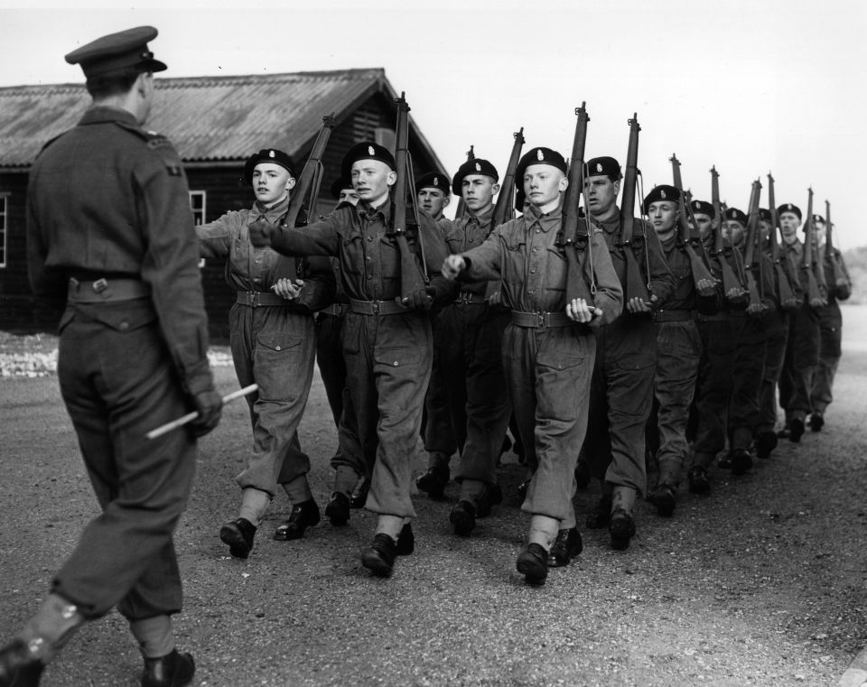 4th February 1953: 18-year old triplets Allan, Brian and Dennis Kirkby reported to North Frith Barracks, Hampshire, following their call-up for National Service. They are square bashing on their first week's training. (Photo by Harry Todd/Fox Photos/Getty Images)