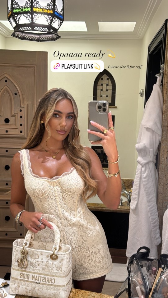 Amber Turner looked sensational in a cream lace playsuit