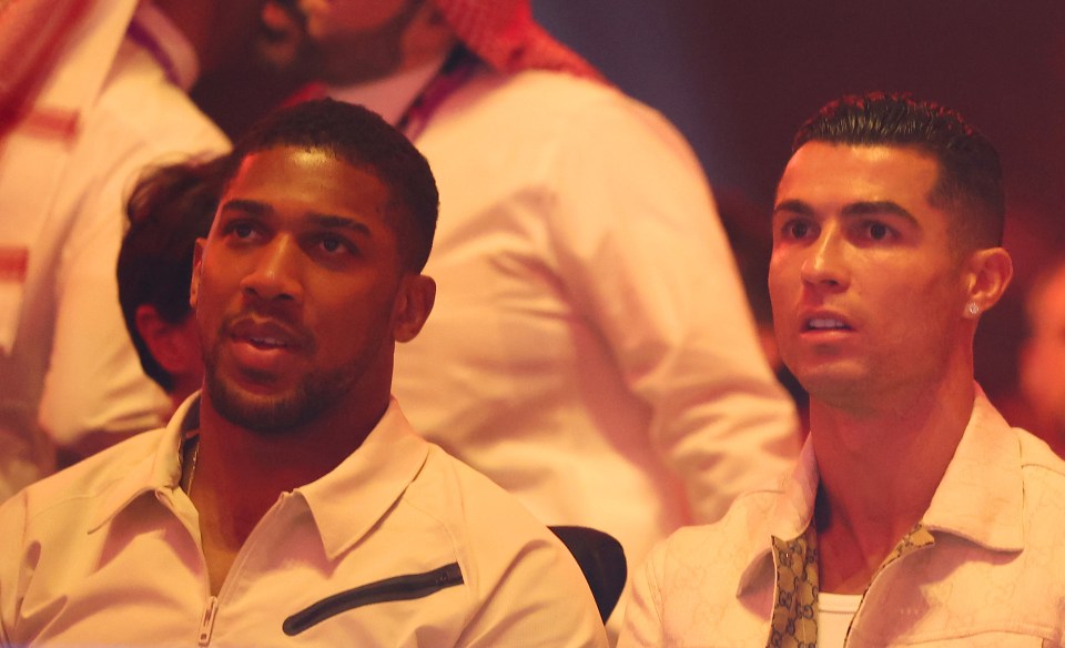 Anthony Joshua and Cristiano Ronaldo sat next to each other