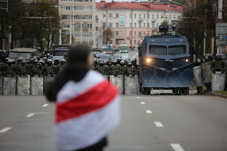 Belarusian law enforcement officers and service members stand guard during a rally in Minsk