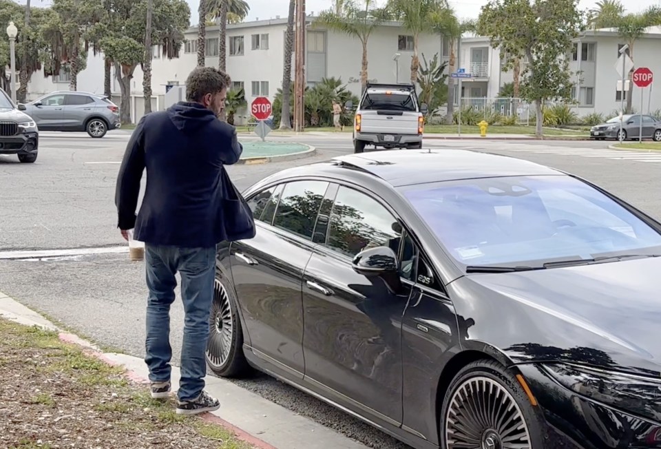 Ben appeared to slam a car door after helping Jennifer into the passenger seat