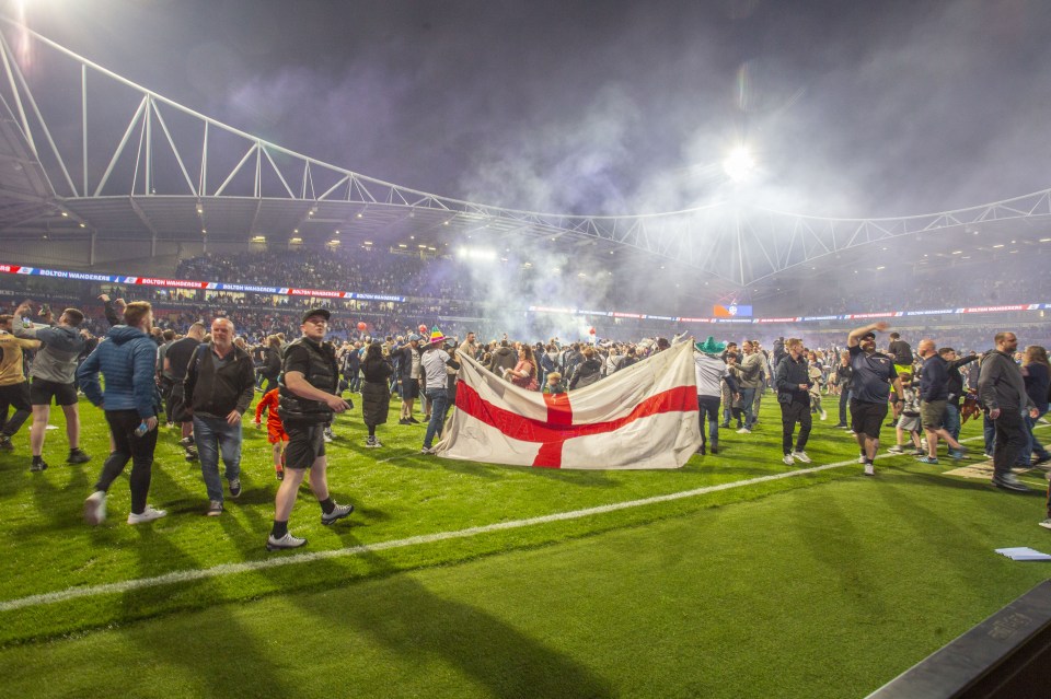 Fans flooded the field after the 5-4 aggregate win over Barnsley