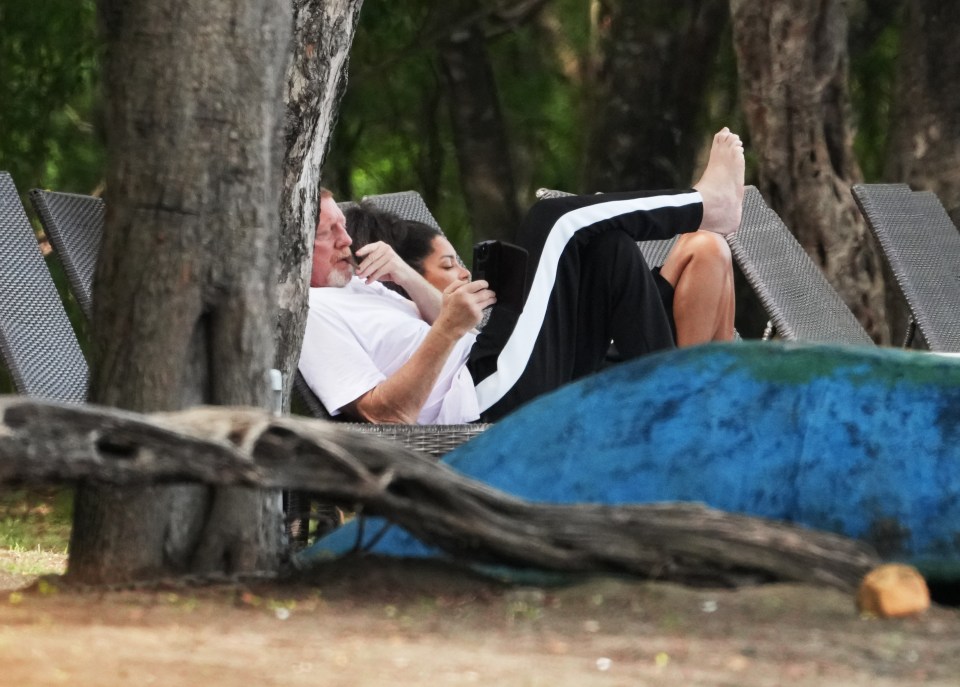 The duo lay back on sun loungers together