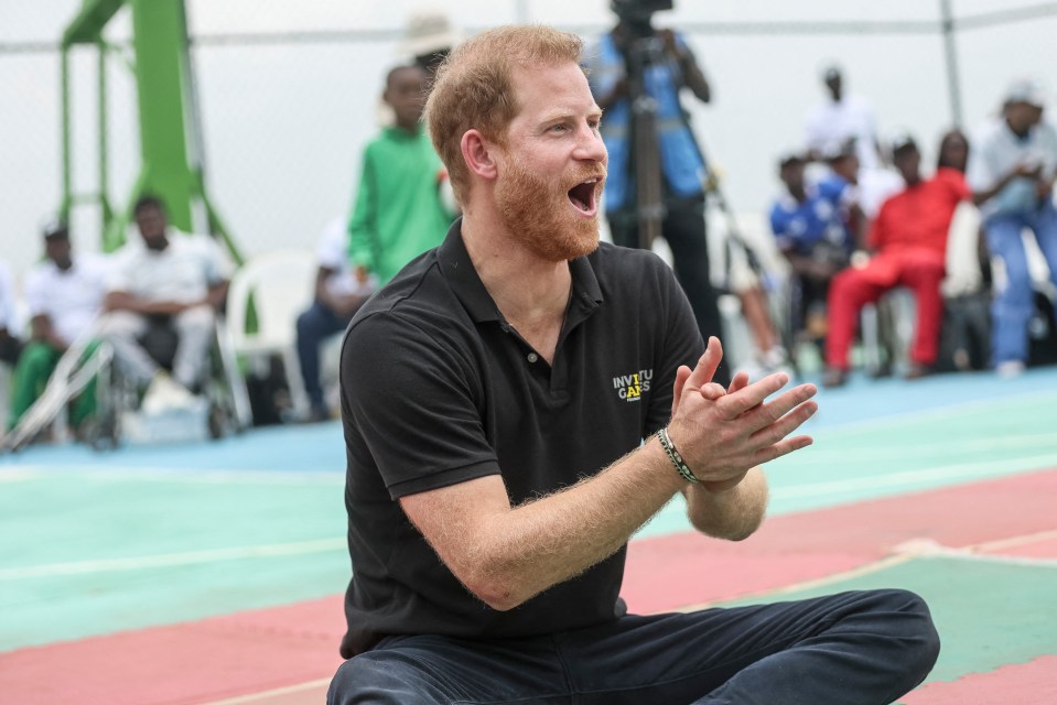 Harry applauds as he takes part in an exhibition sitting volleyball match with Invictus Games hopefuls on May 11