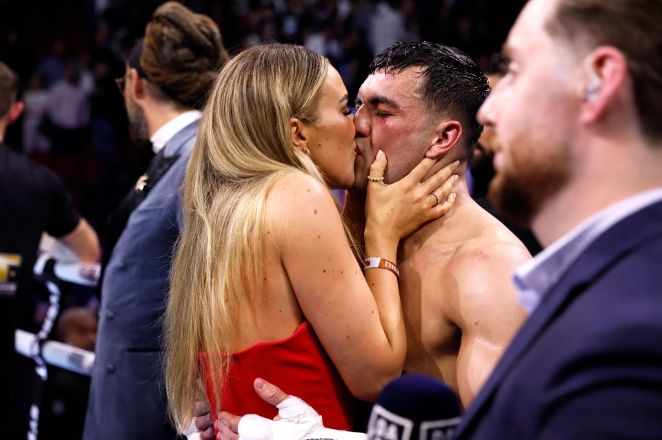 Lauren and Jack put on the PDA in the ring