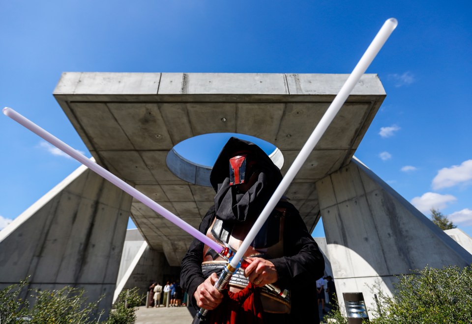 A man from Alabama poses as Darth Revan as the first passengers arrive for a trip on the Galactic Starcruiser in March 2022