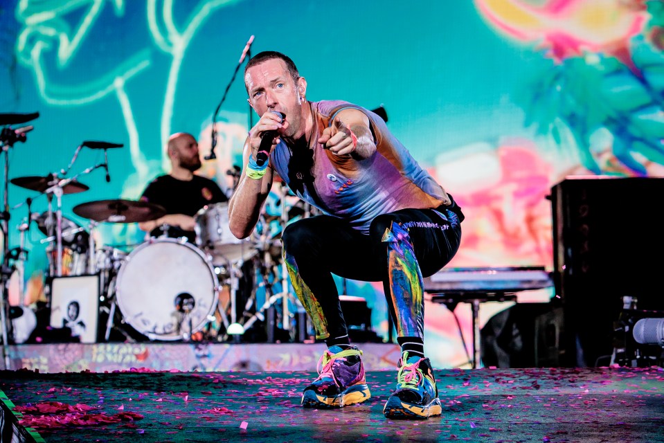 MILAN, ITALY - JUNE 25: (EDITORIAL USE ONLY) Will Champion and Chris Martin of Coldplay perform at Stadio San Siro, on June 25, 2023 in Milan, Italy. (Photo by Sergione Infuso/Corbis via Getty Images for ABA)