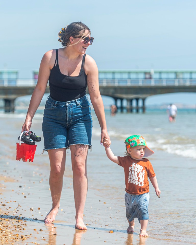 Corin Jones & son Sully, 2, on the beach in Bournemouth