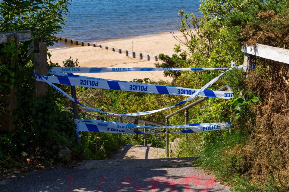 Steps down to the beach were cordoned off on Saturday as police launched a murder investigation