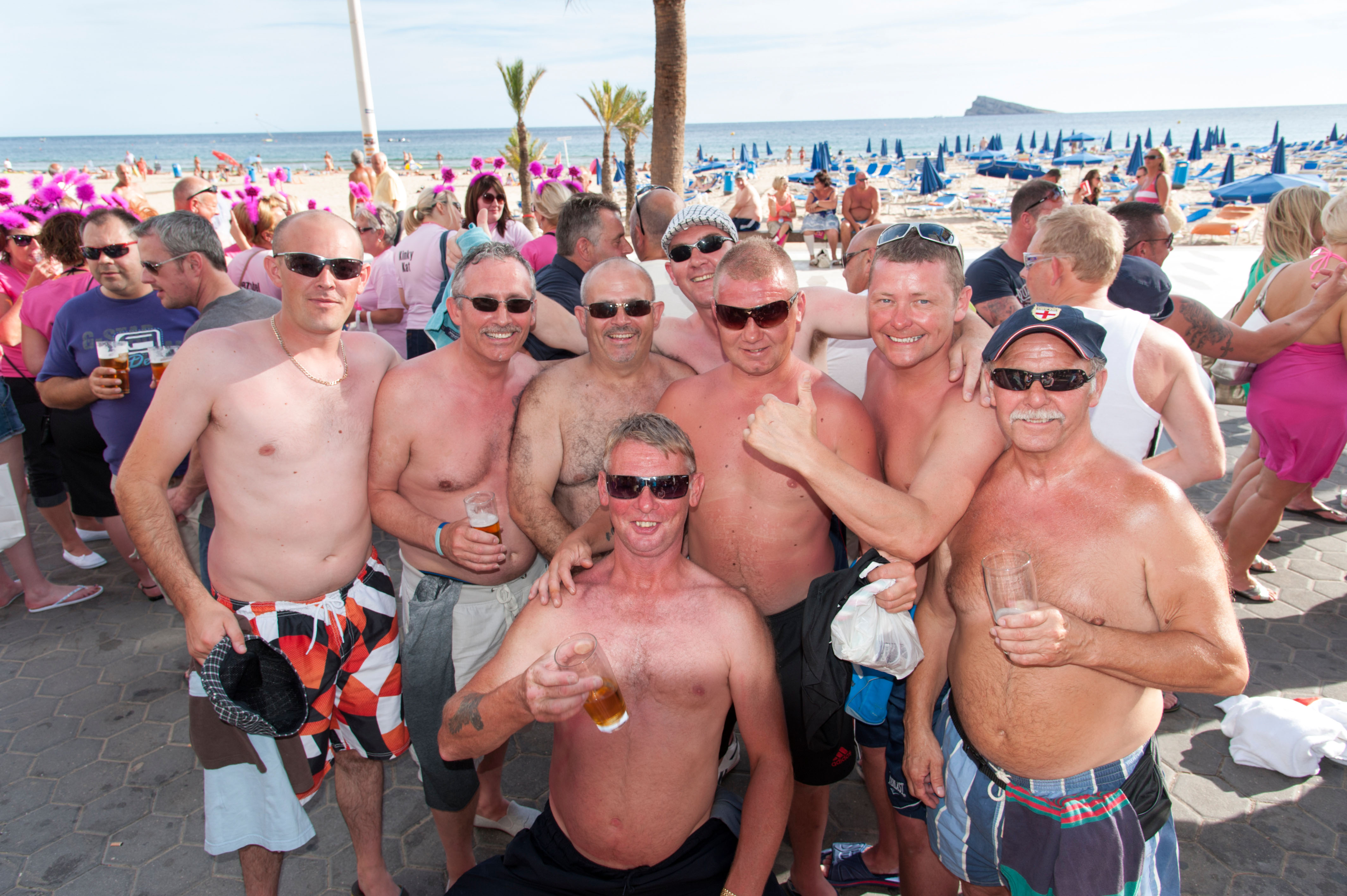 Topless British holidaymakers drinking at a bar in Costa Blanca, Spain